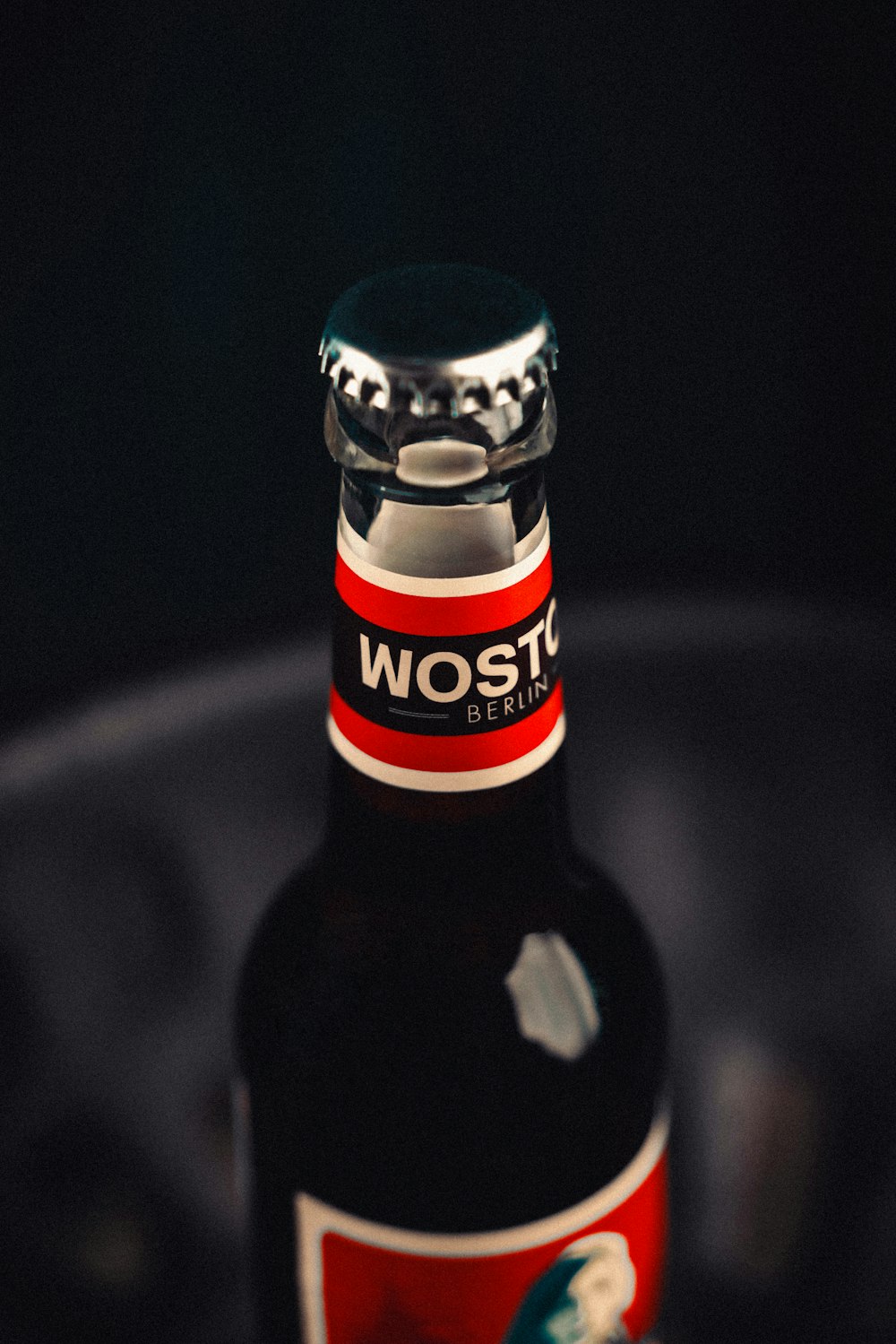 a close up of a bottle of beer on a table