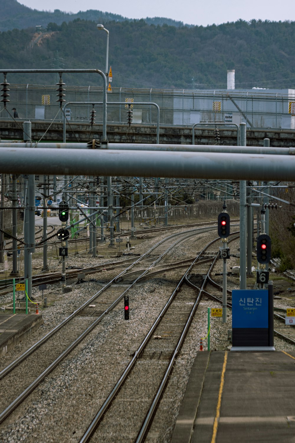 a view of a train track with a mountain in the background