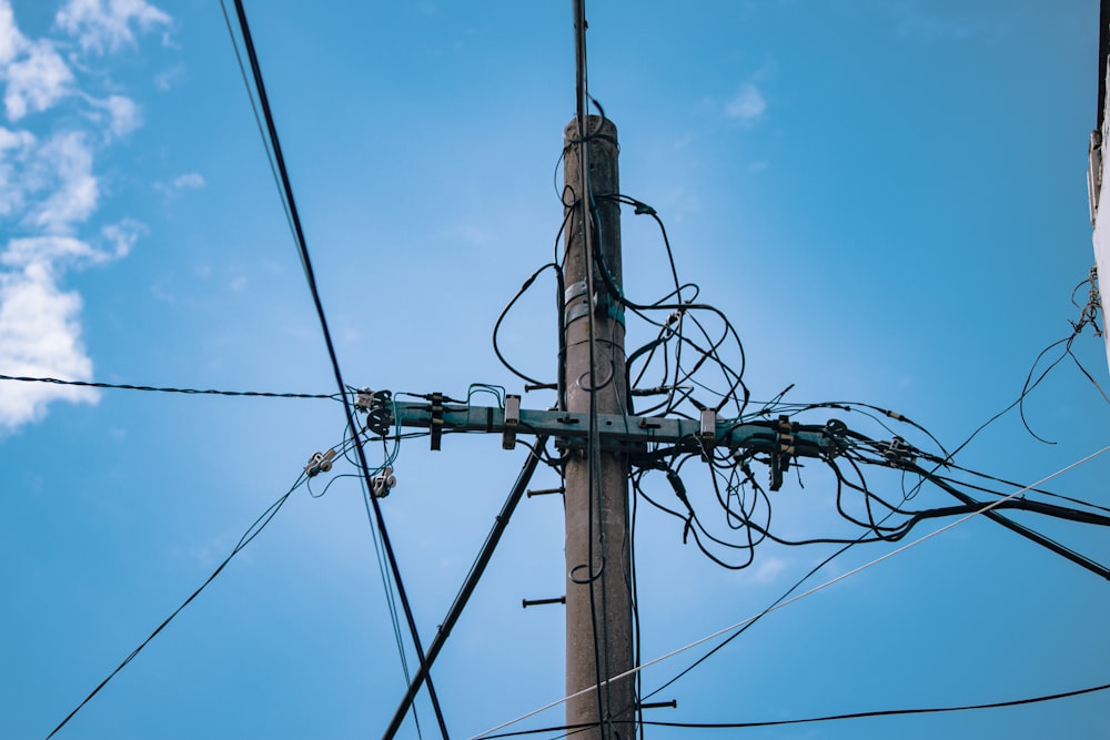 a telephone pole with wires and wires attached to it
