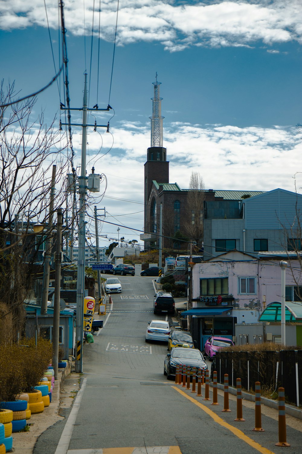 a city street with cars parked on the side of it