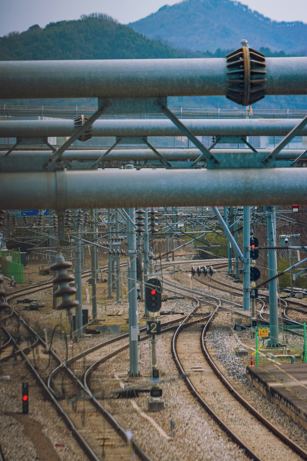 a view of a train track with a mountain in the background