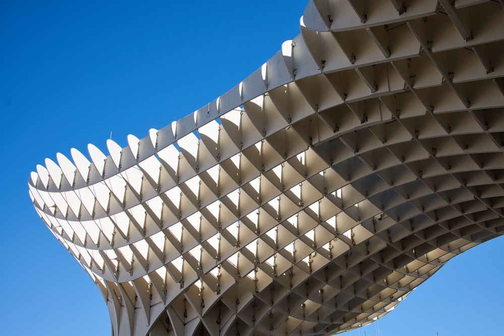 a large white structure with a sky background