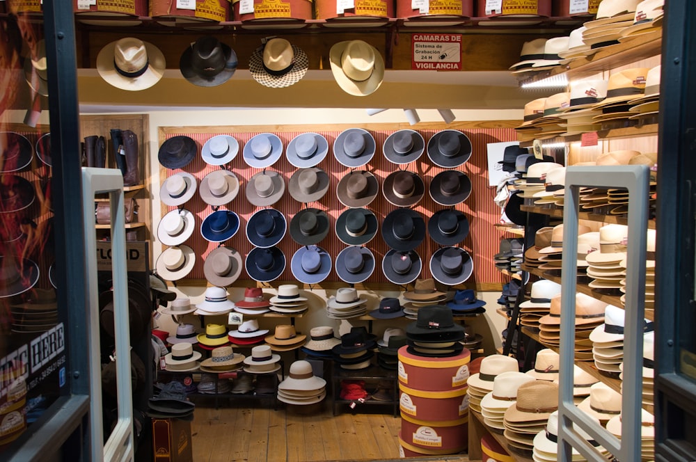 a room filled with lots of hats on shelves