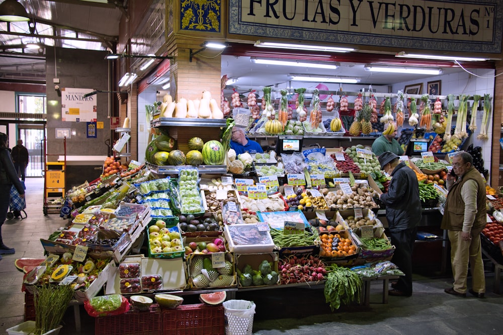 a fruit and vegetable stand in a market