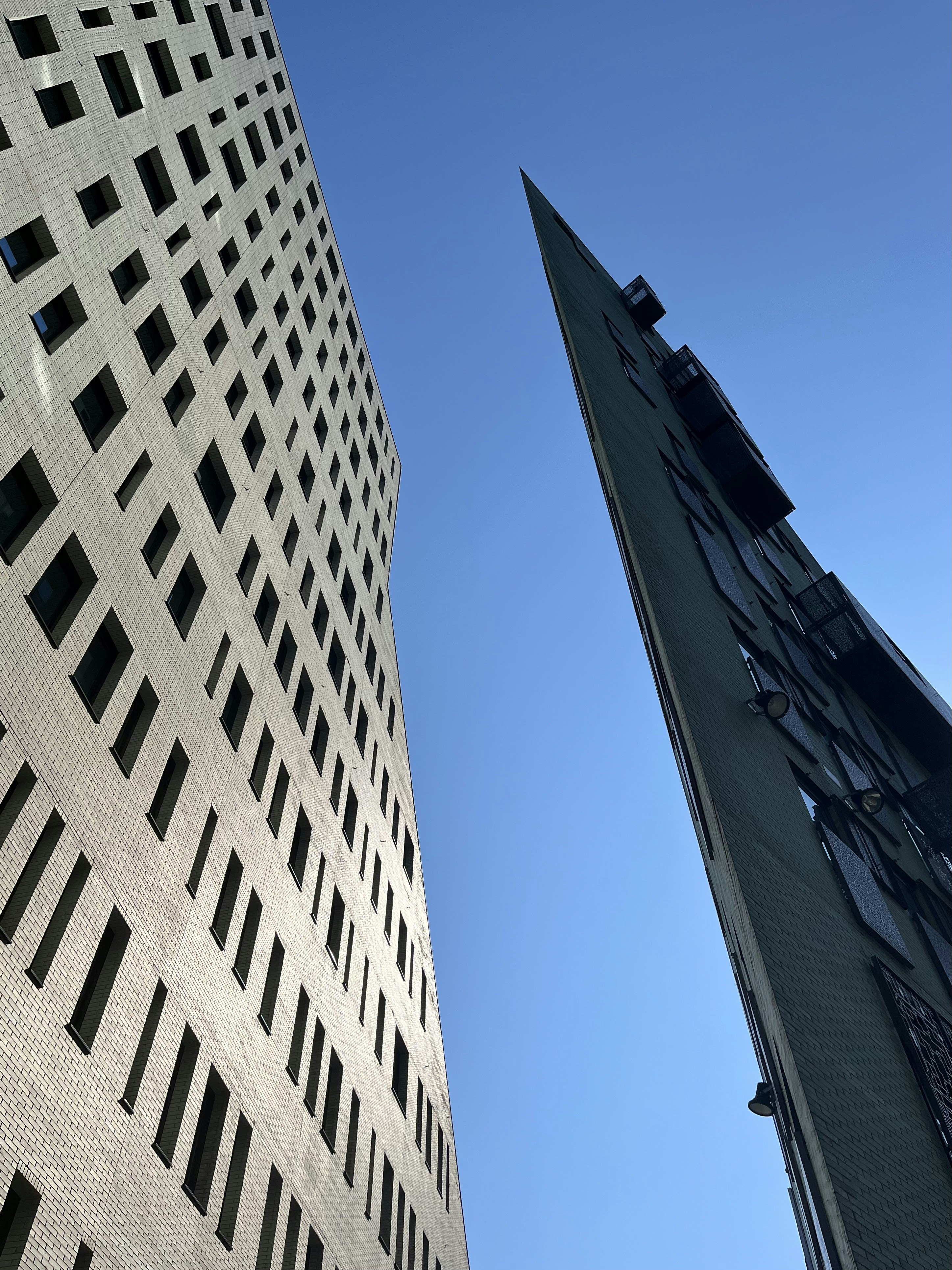 a tall building with a clock on the side of it