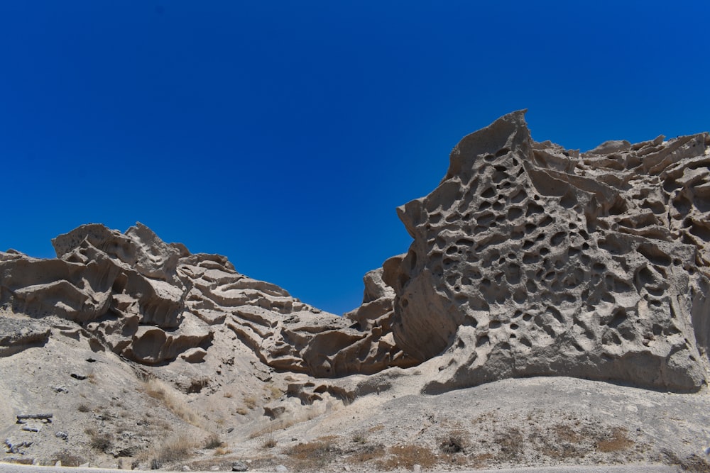 a rock formation in the middle of a desert