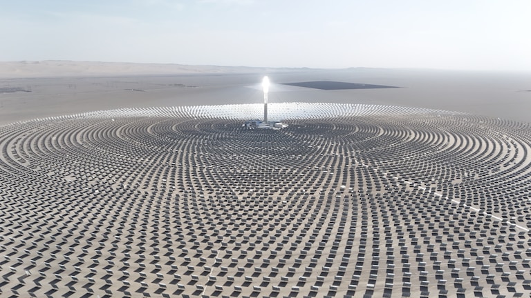 a large solar array in the middle of a desert
