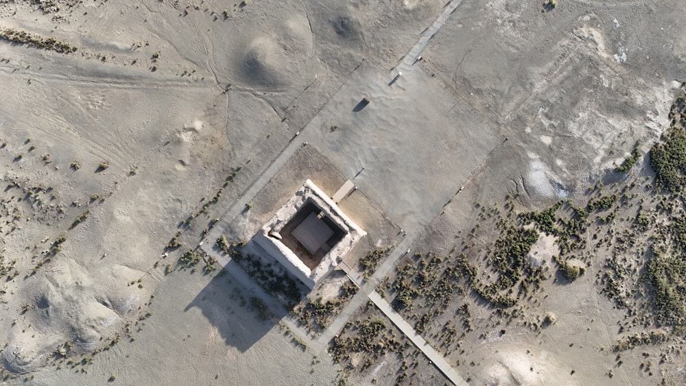 an aerial view of a building in the middle of a desert