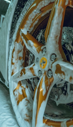 a close up of a snow covered car wheel