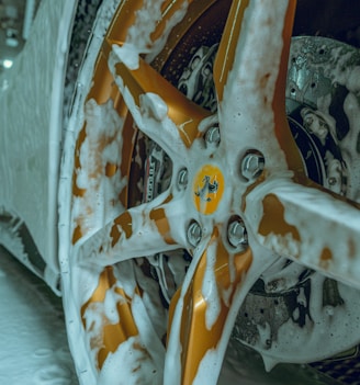 a close up of a snow covered car wheel