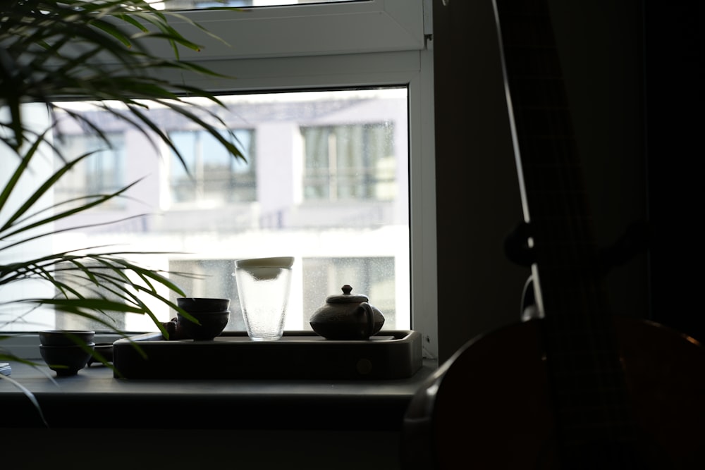 a potted plant sitting next to a window sill