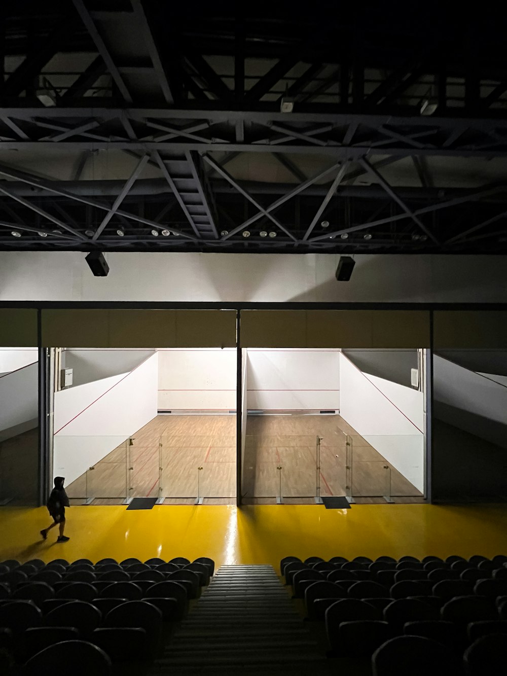 a person standing in front of an empty stage