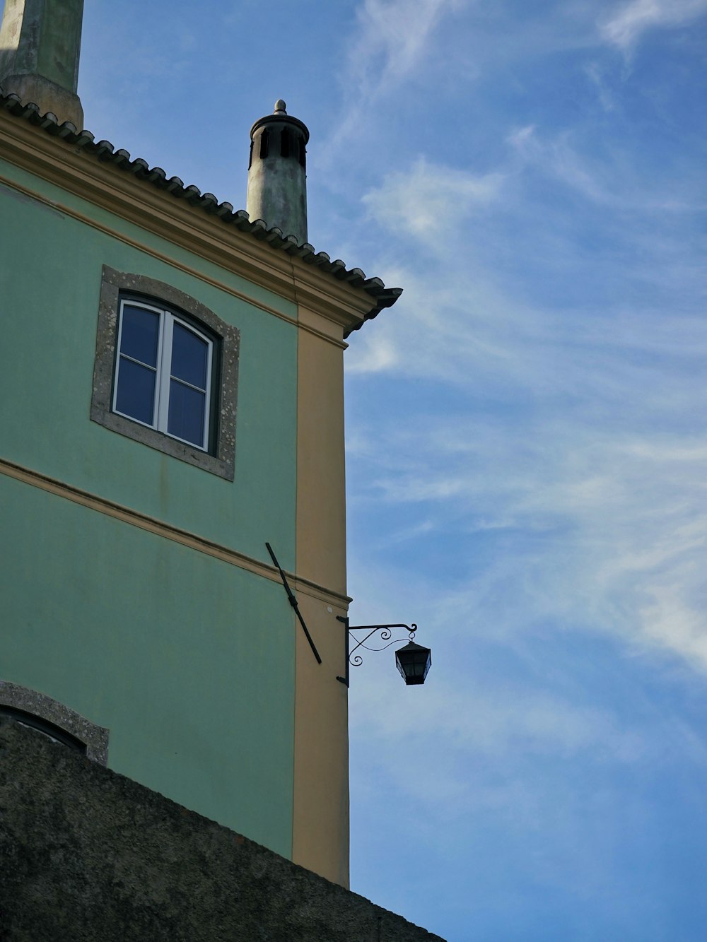 a tall building with a clock on the side of it