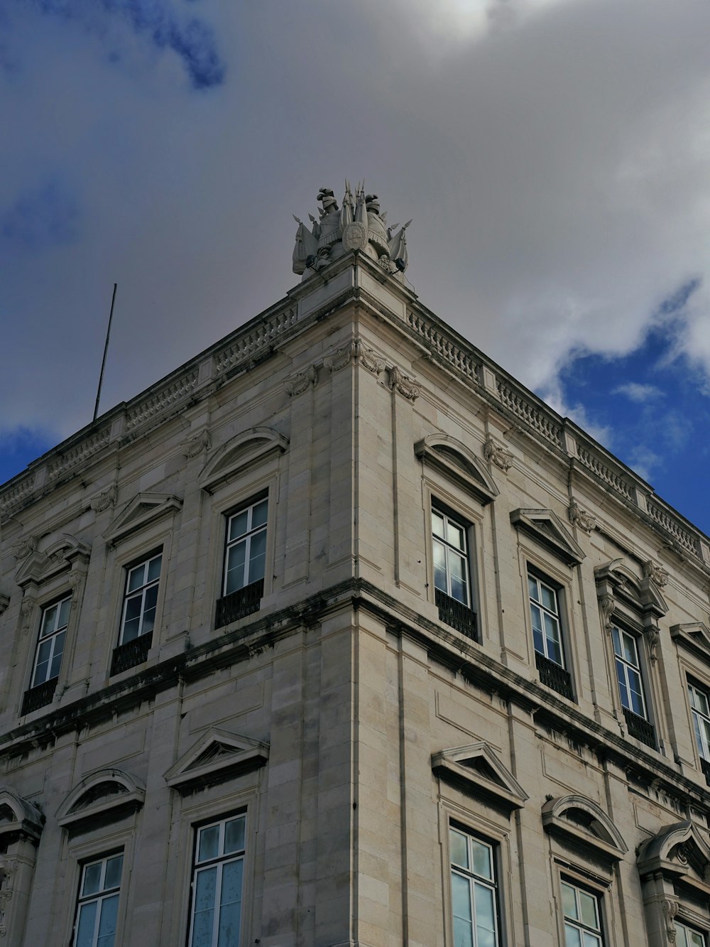 a tall building with a clock on the top of it