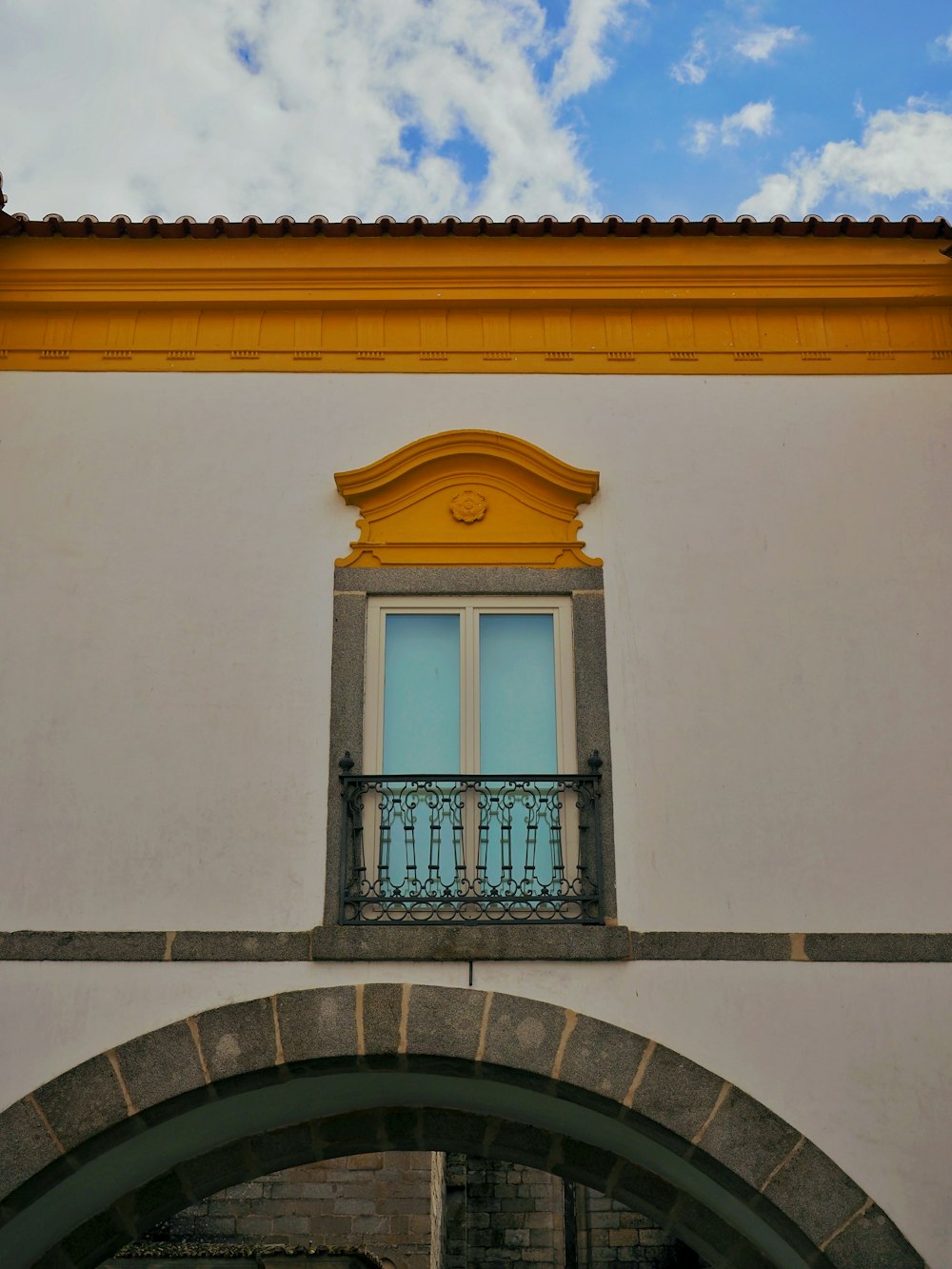 a building with a window and a balcony