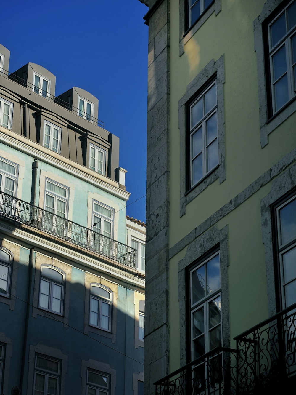 a building with a balcony and balconies in front of it