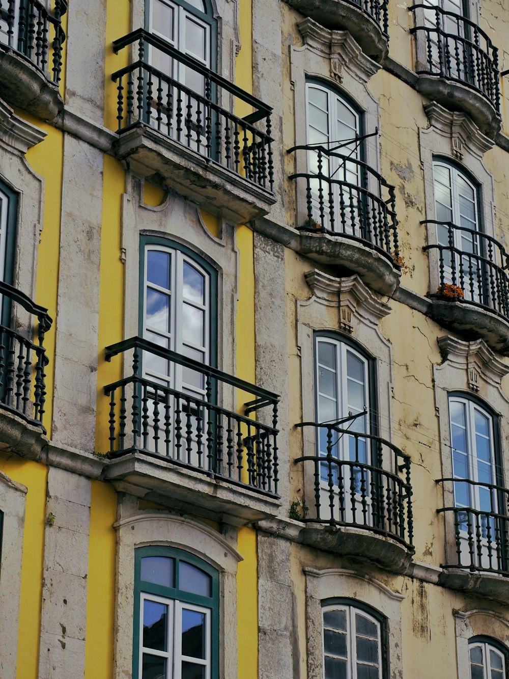 a tall building with balconies and windows