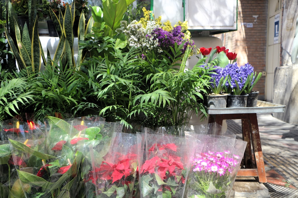 a bunch of flowers that are sitting on a table