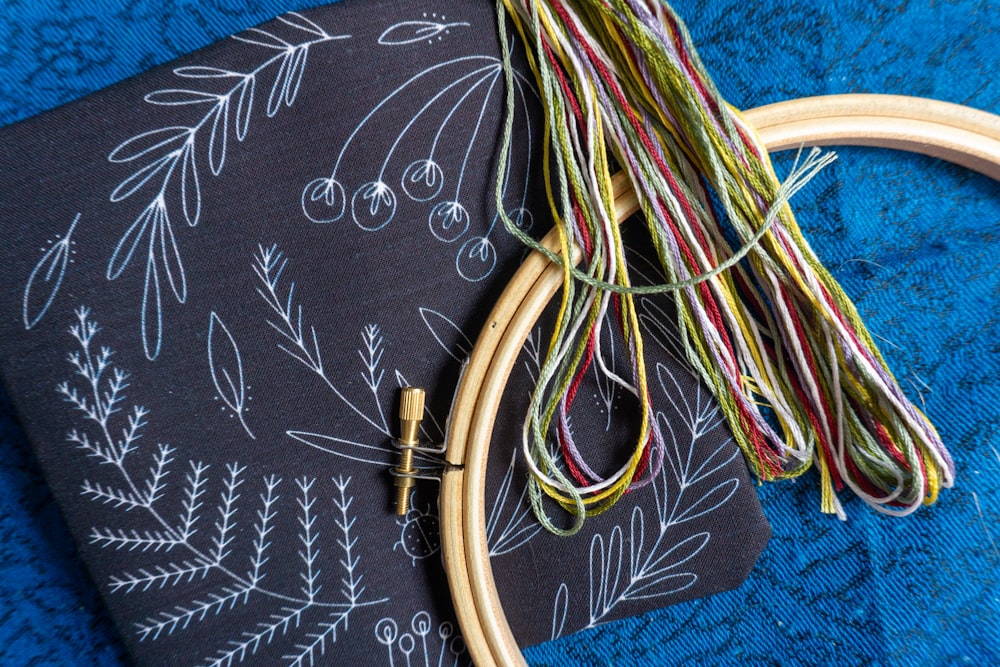 a close up of a piece of cloth with a wooden hoop