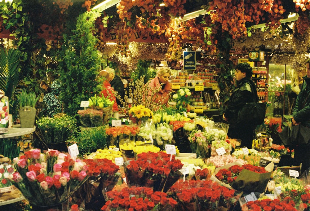 a flower shop filled with lots of colorful flowers