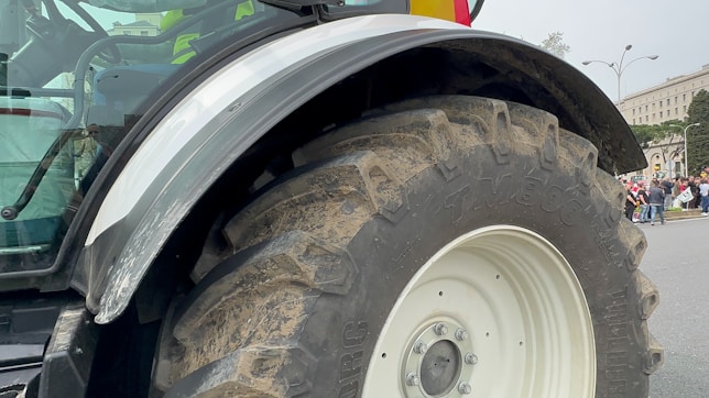 a large tractor parked on the side of a road