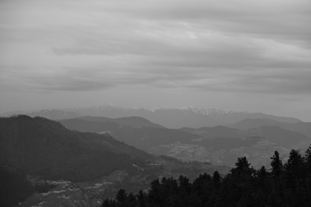 a black and white photo of a mountain range