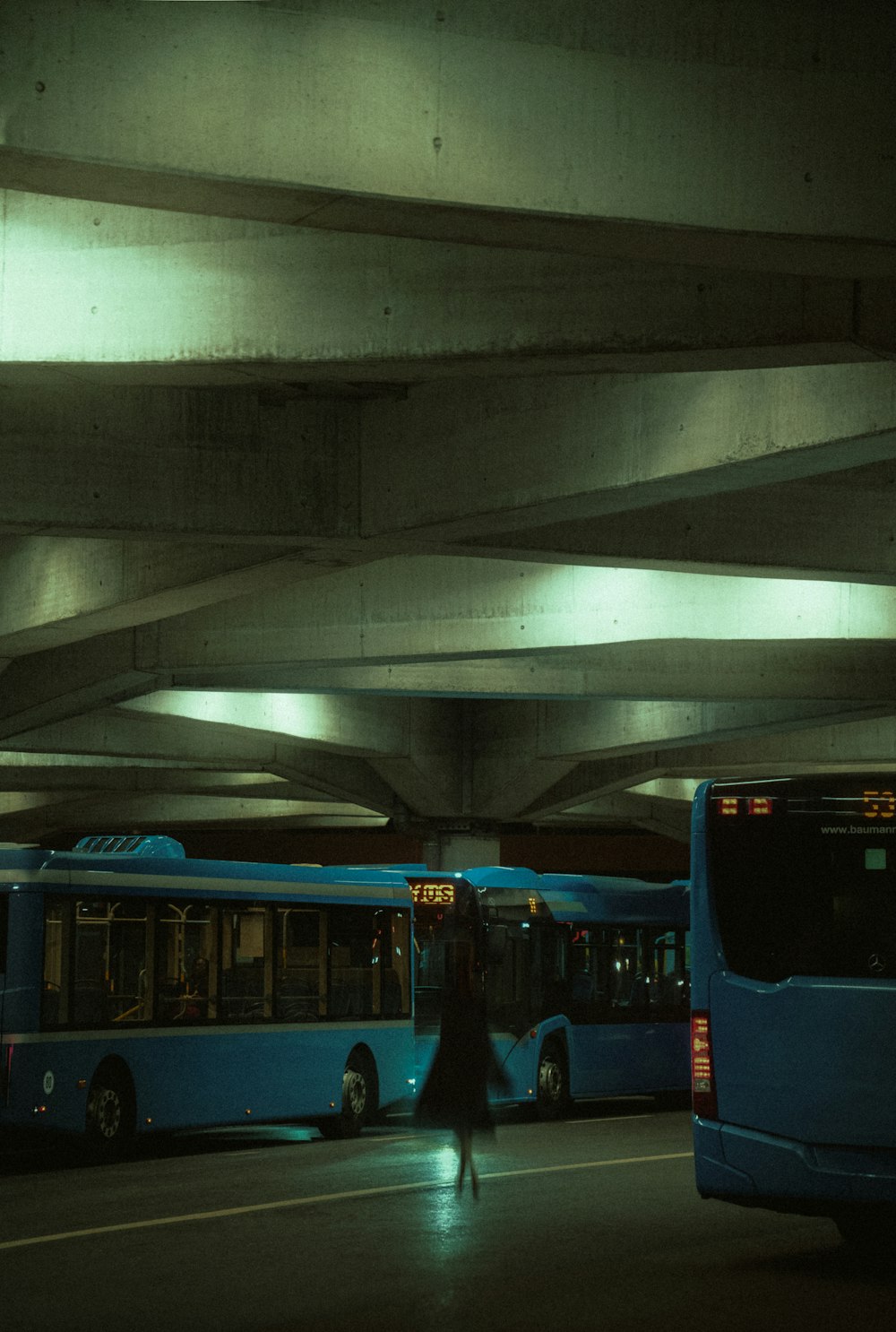 a couple of buses that are sitting in the street