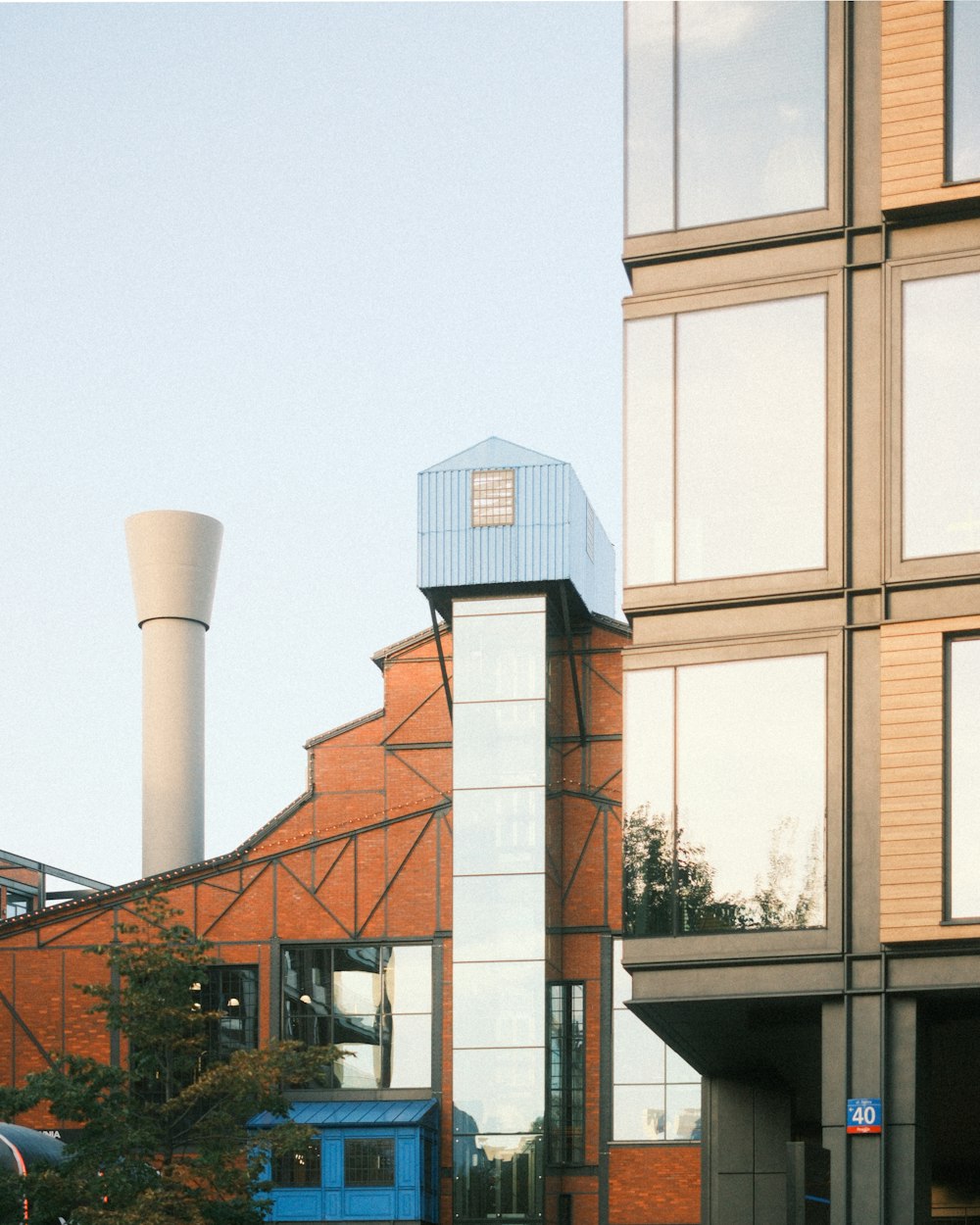 a blue truck parked in front of a tall building