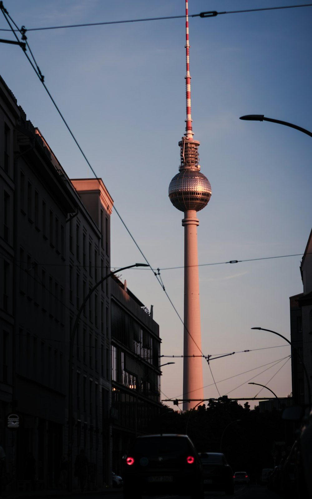 a tall tower with a red and white striped top