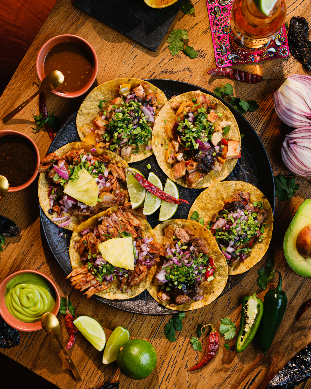 Tacos and guacamole on a wooden table