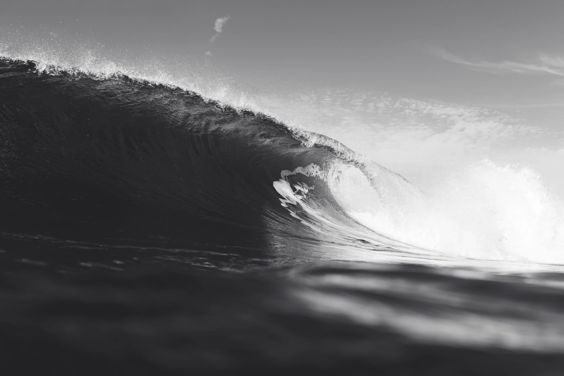 a person riding a wave on top of a surfboard