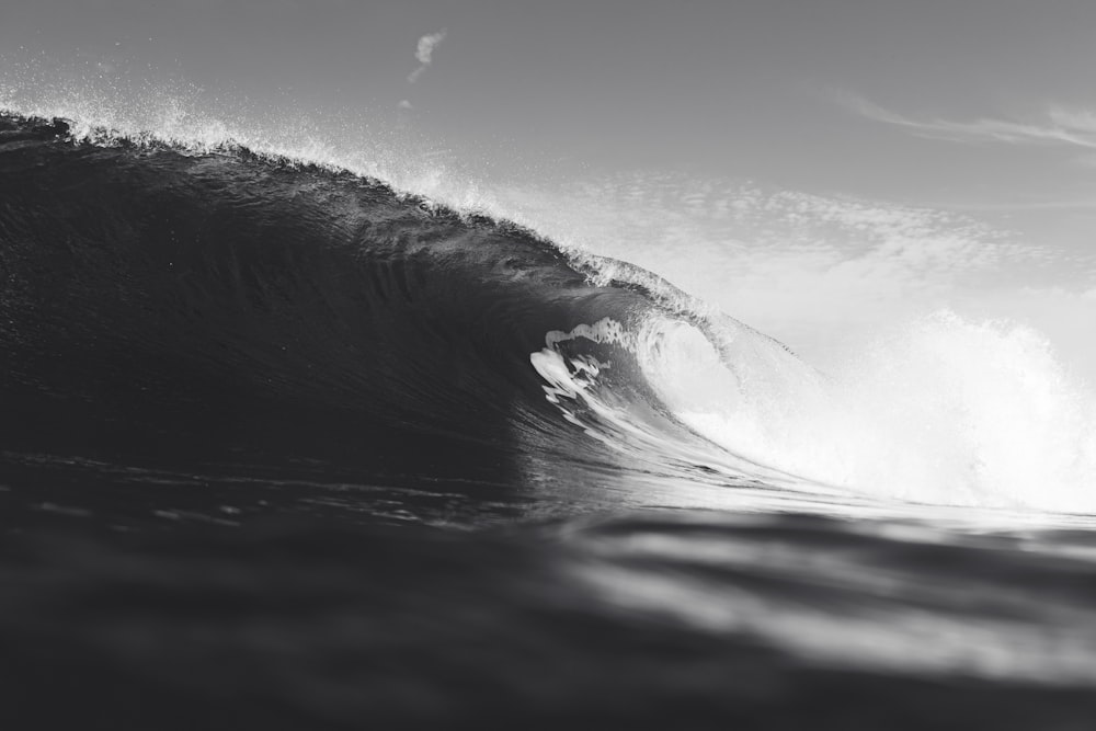 a person riding a wave on top of a surfboard