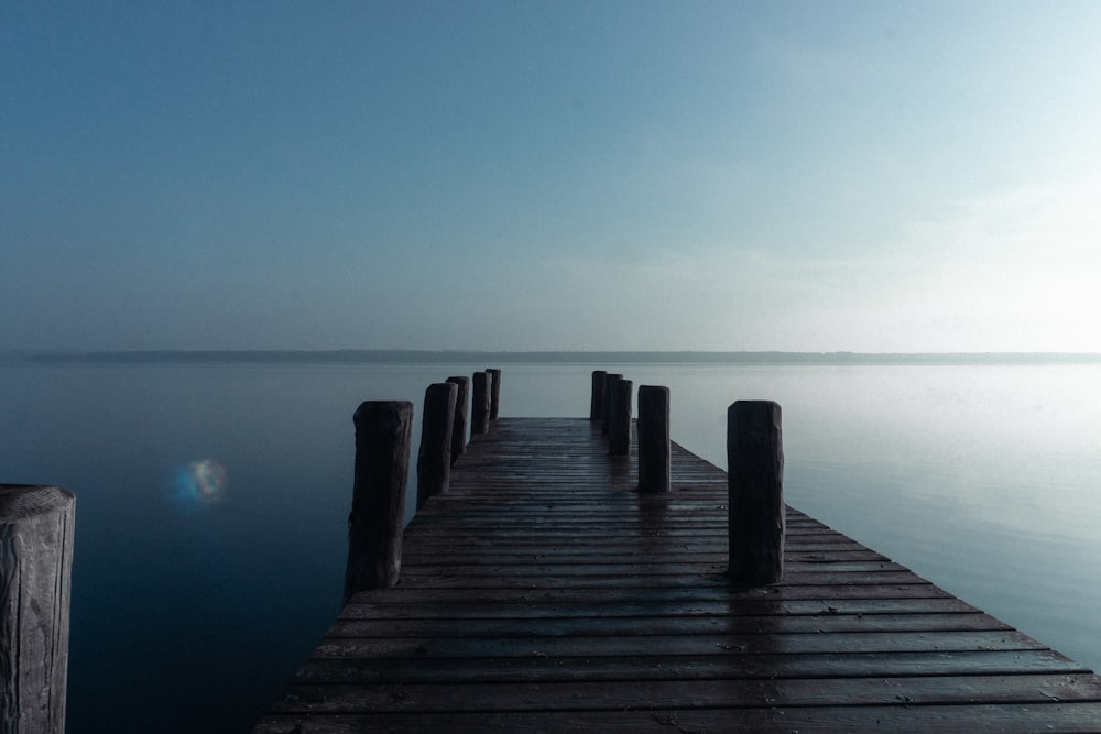 a long wooden dock sitting on top of a body of water