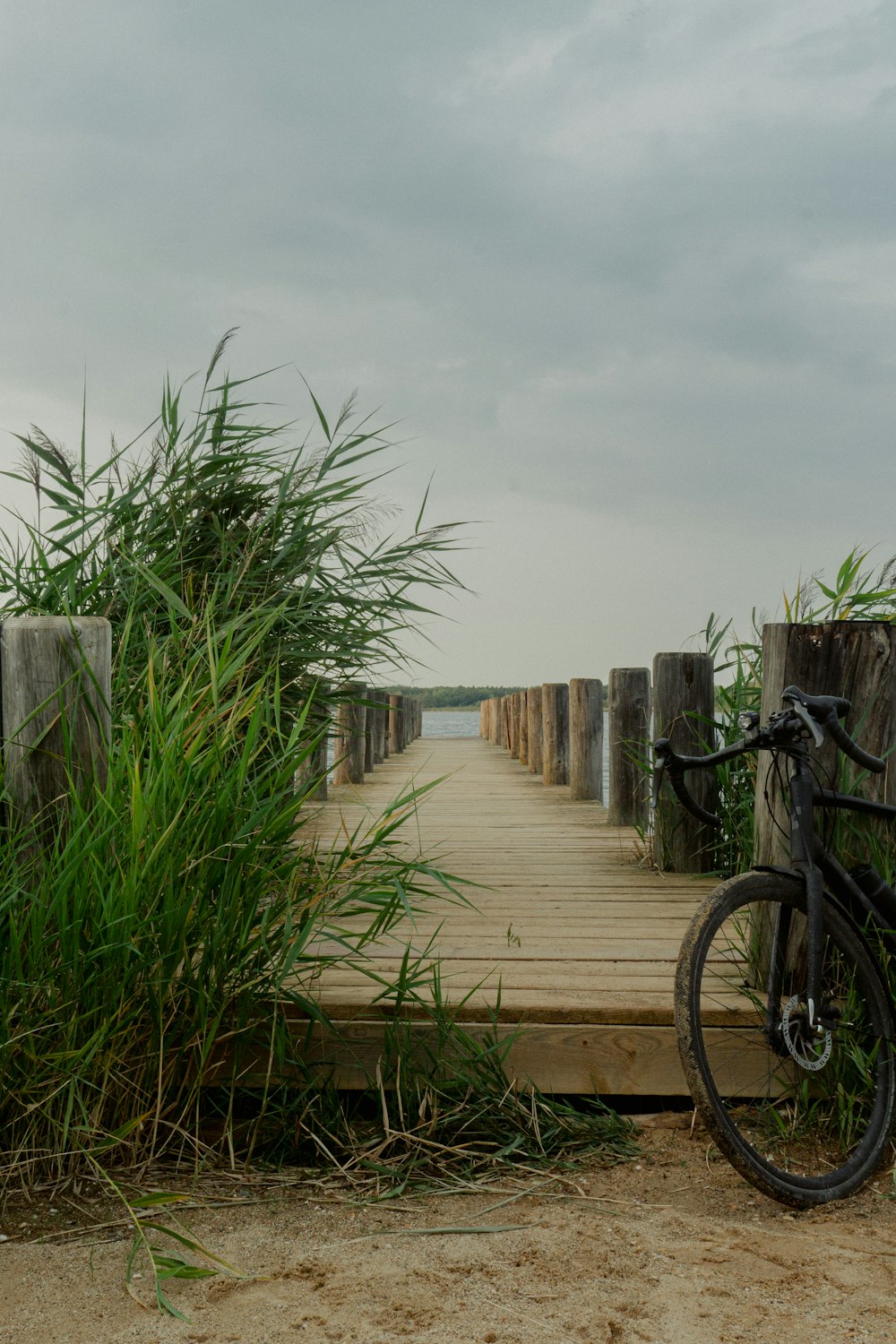 a bike is parked on a wooden bridge