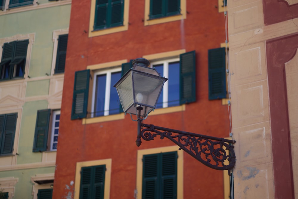 a street light in front of a red building
