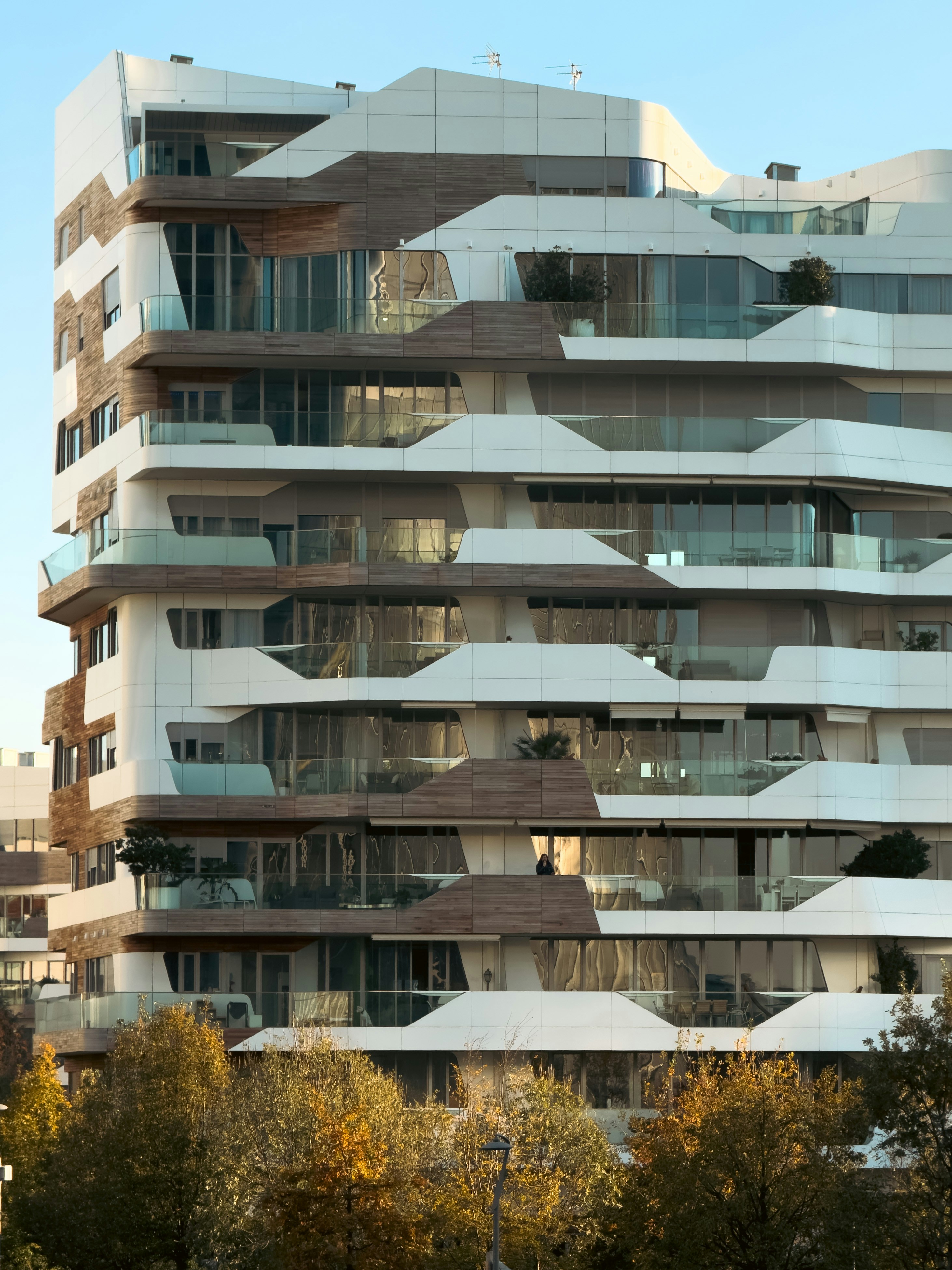 A very tall building with lots of windows and balconies photo – Free ...
