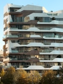 a very tall building with lots of windows and balconies