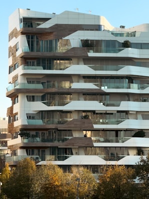 a very tall building with lots of windows and balconies