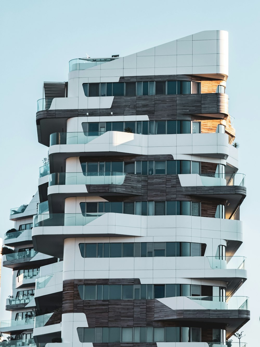 a very tall building with many windows and balconies