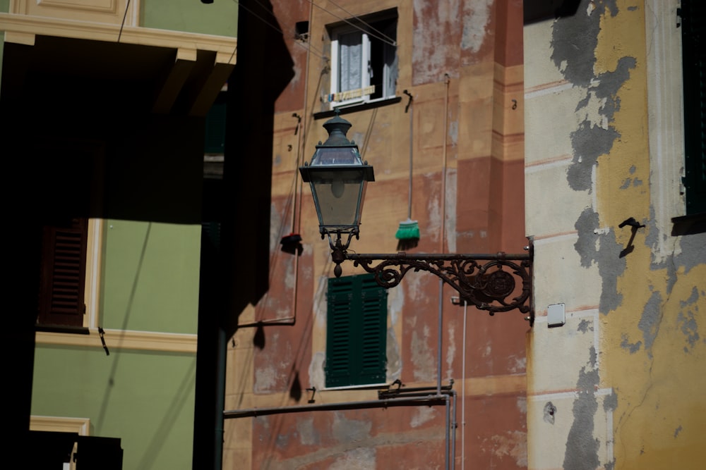 a street light hanging from the side of a building