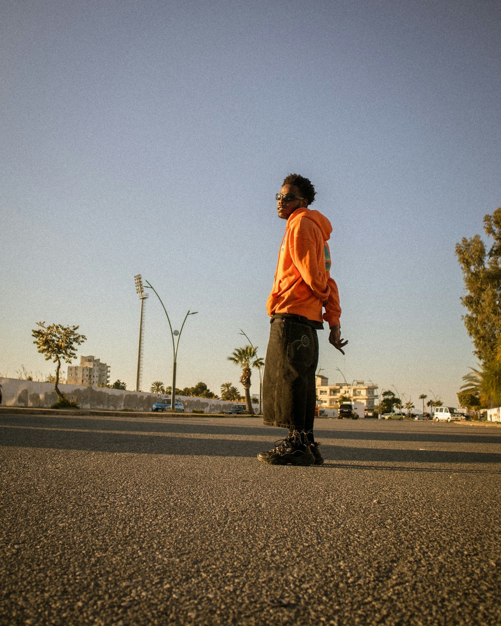 a man riding a skateboard down a street