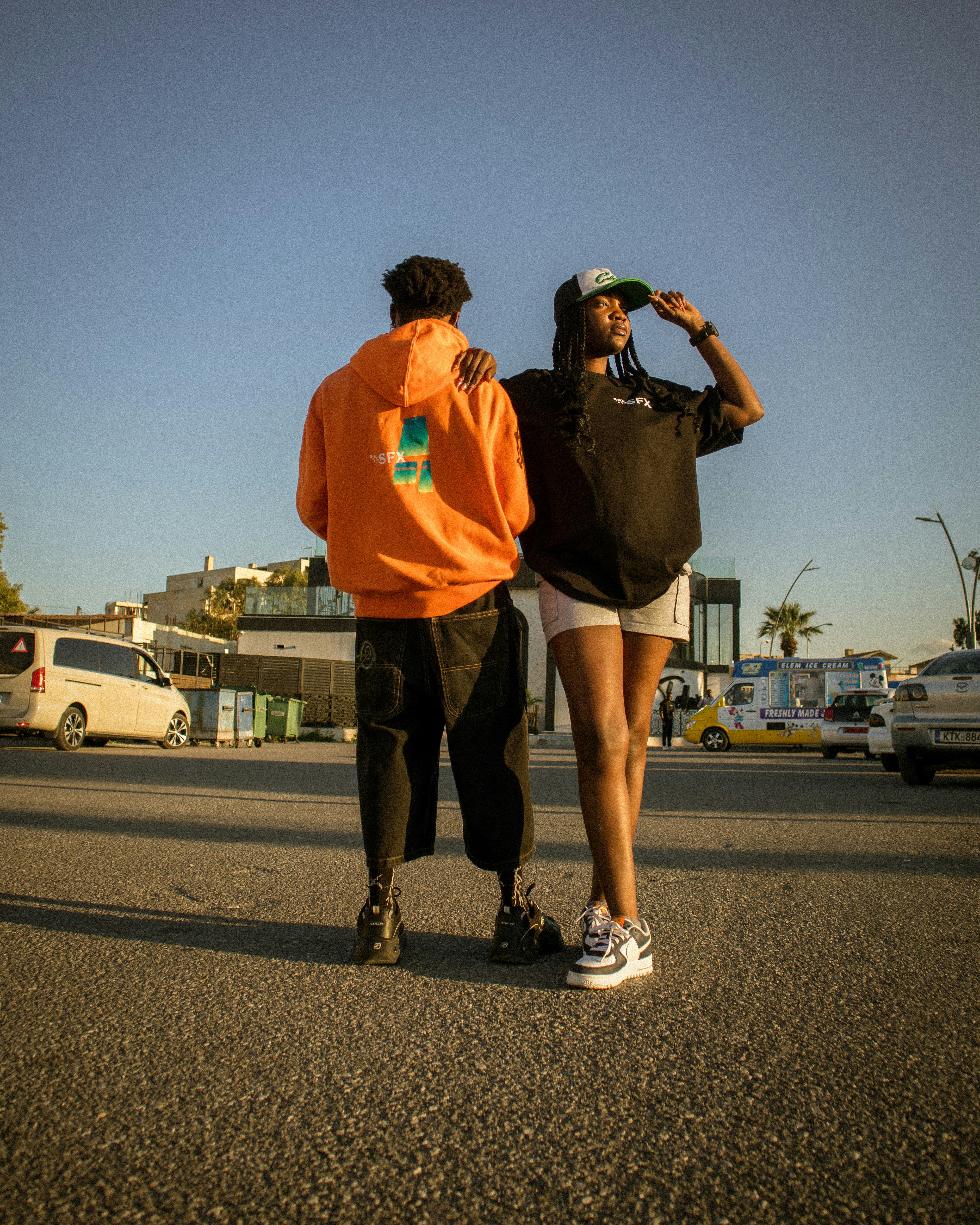 a couple of people that are standing in the street