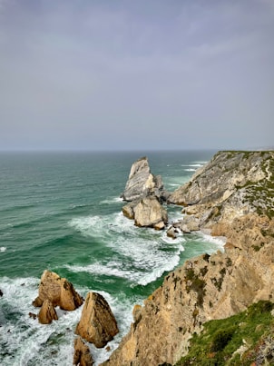 a view of the ocean from the top of a cliff