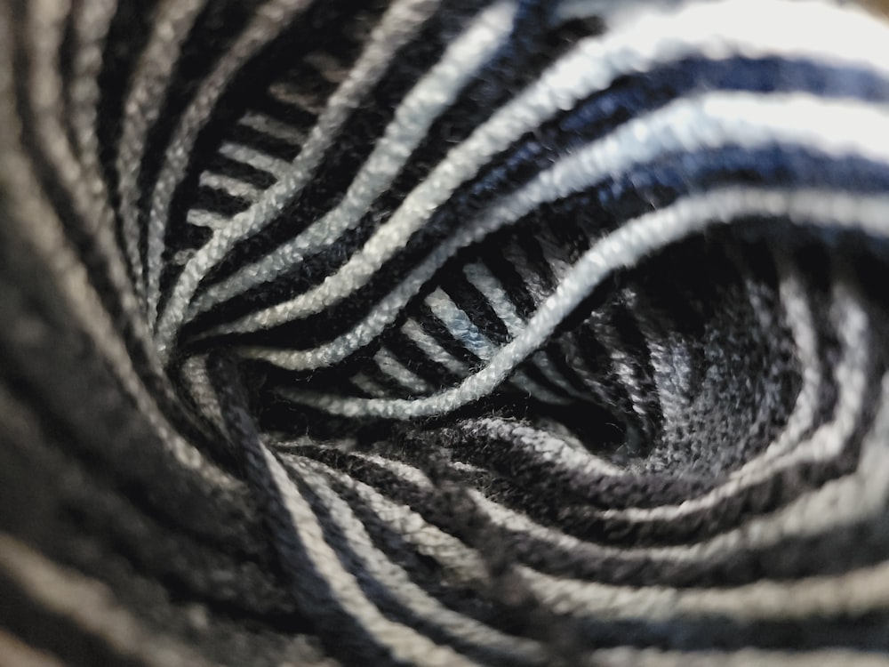 a close up of a black and white striped yarn