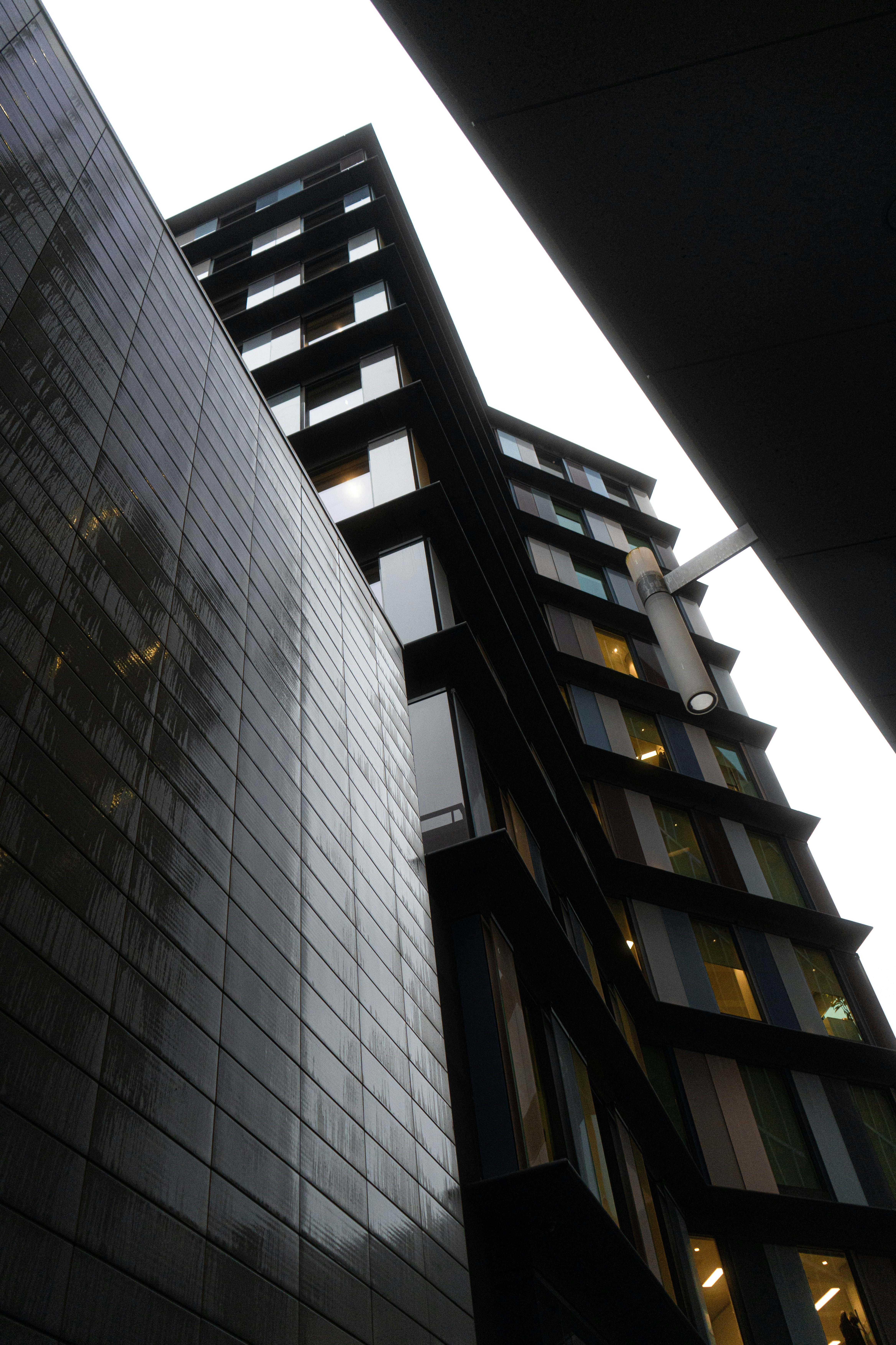 a tall building next to a very tall building