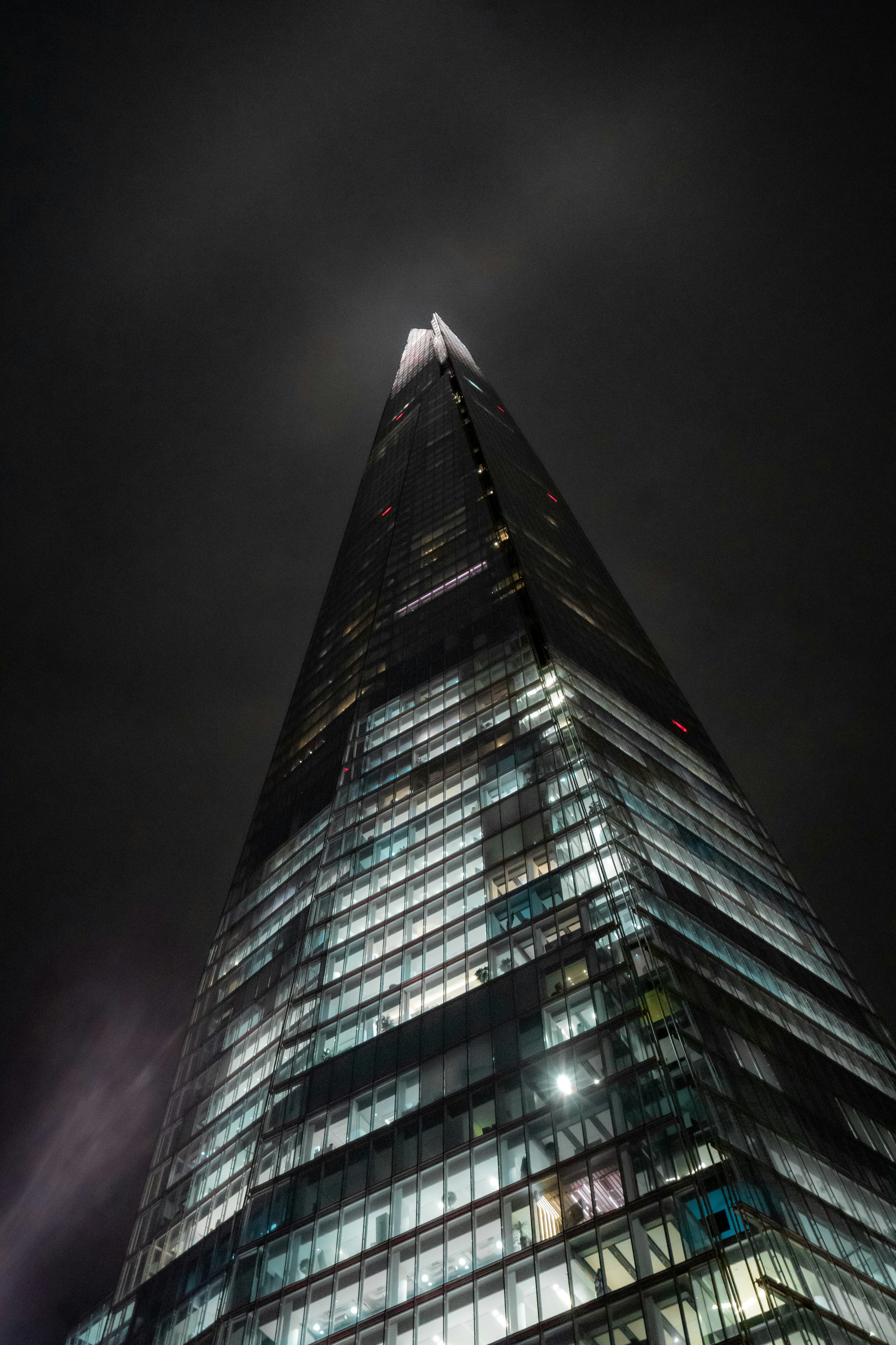 a very tall building lit up at night