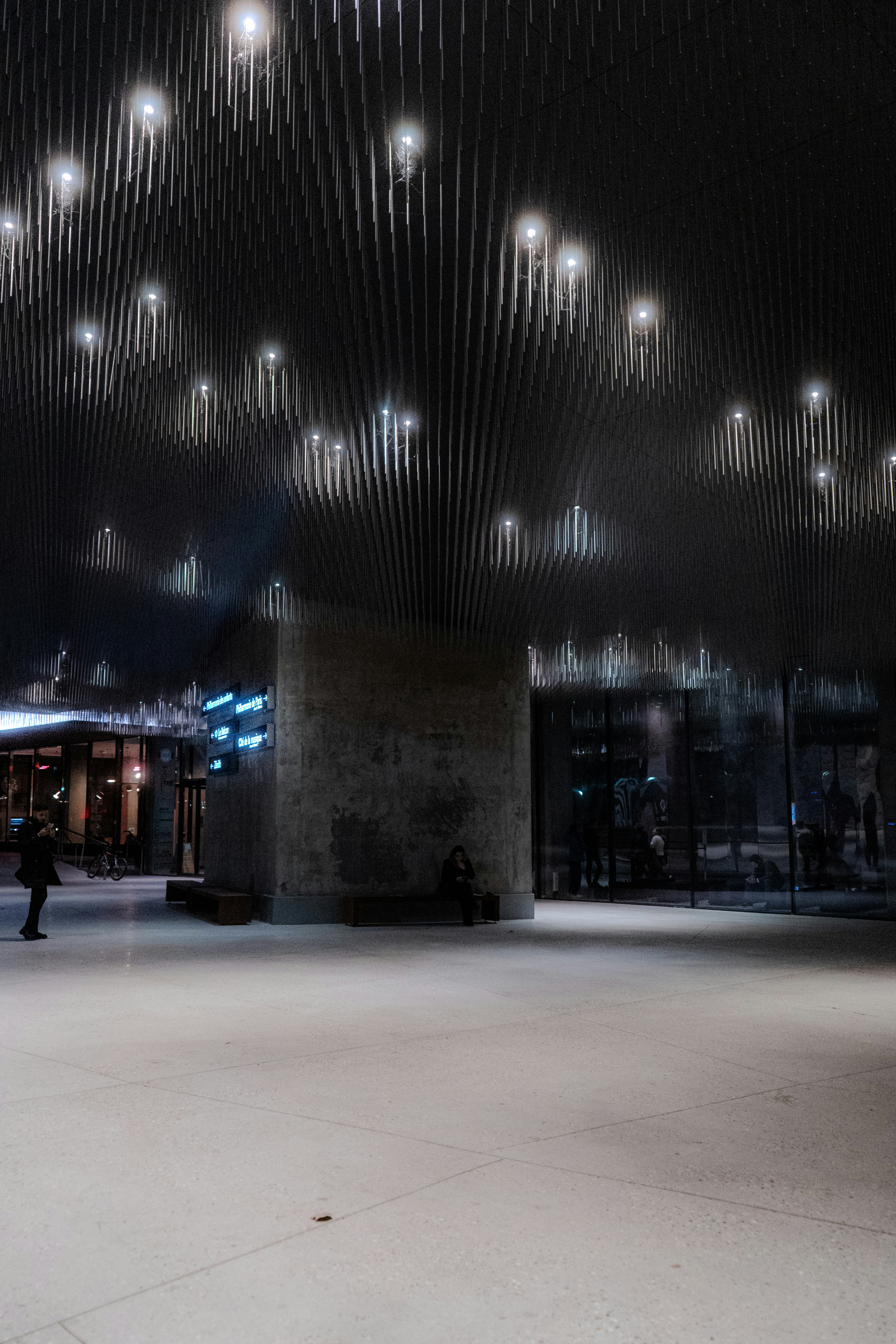 a person standing in a large room with lots of lights