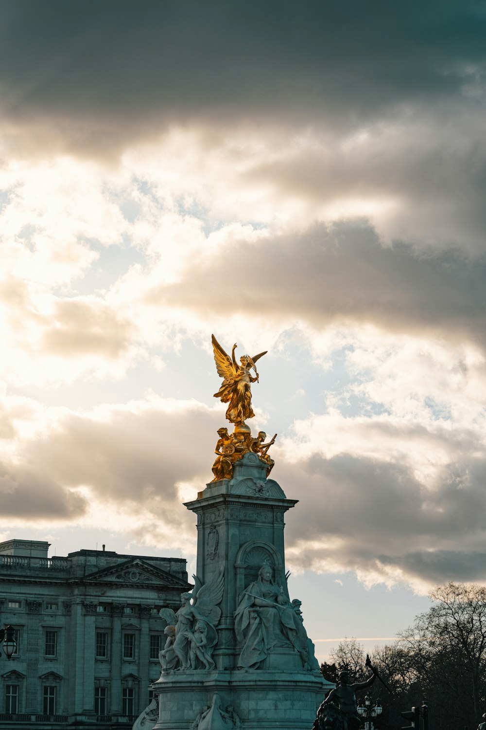 a statue of an angel on top of a building