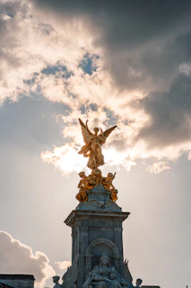 a statue of an angel on top of a building