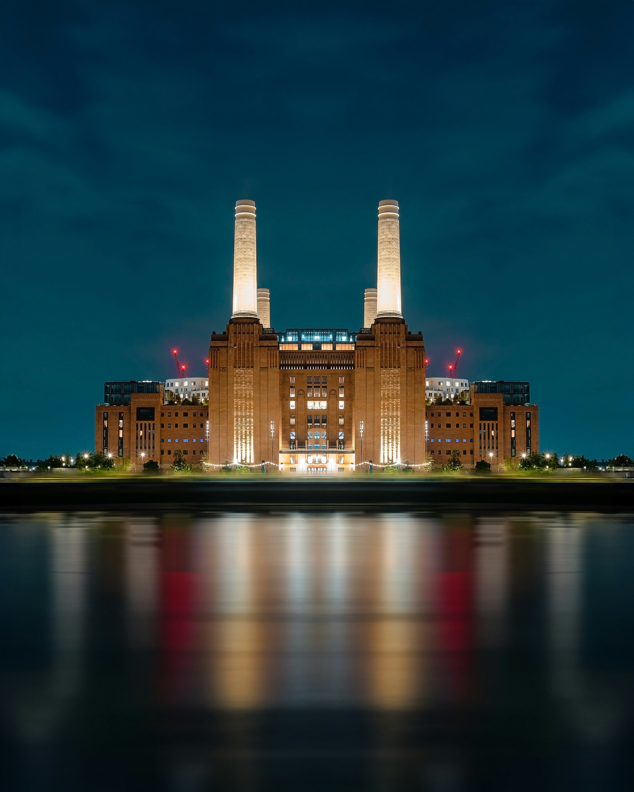 a large building with two towers lit up at night